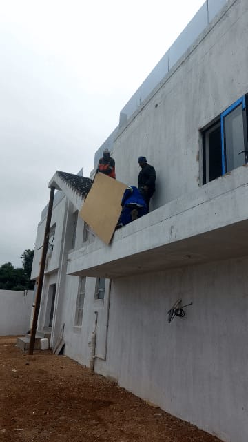 In-house installation team fitting glass balustrade